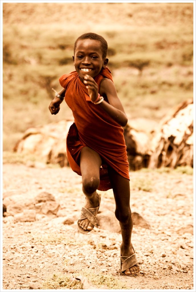 "Running Samburu Boy," by Erik (HASH) Hersman, licensed under CC by 2.0 at https://www.flickr.com/photos/18288598@N00/4611262568