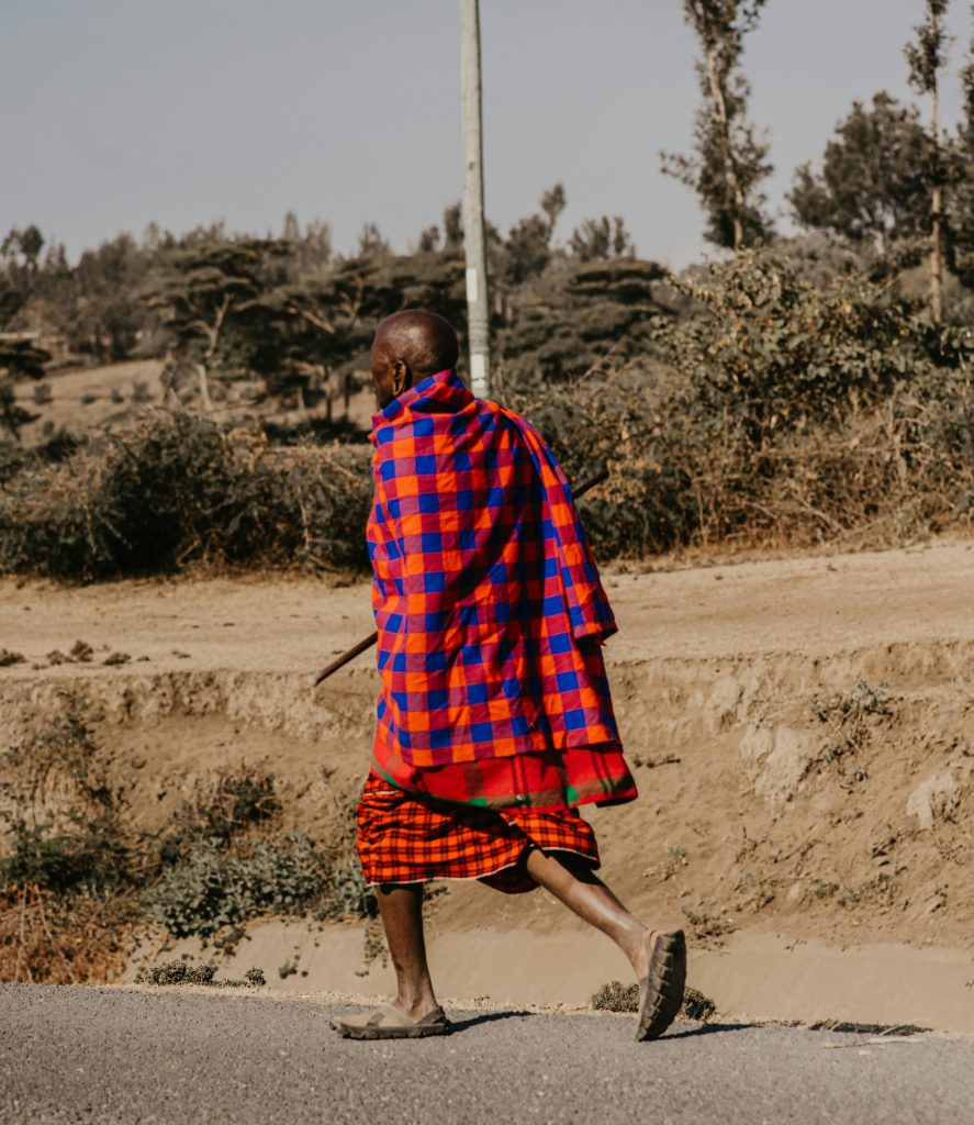 "Mam Walking under the Scorching Heat of the Sun," by Peter Godfrey, open copyright at https://www.pexels.com/photo/man-walking-under-the-scorching-heat-of-the-sun-13533665/